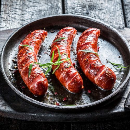 grilled-sausage-with-fresh-rosemary-on-black-burnt-table.jpg